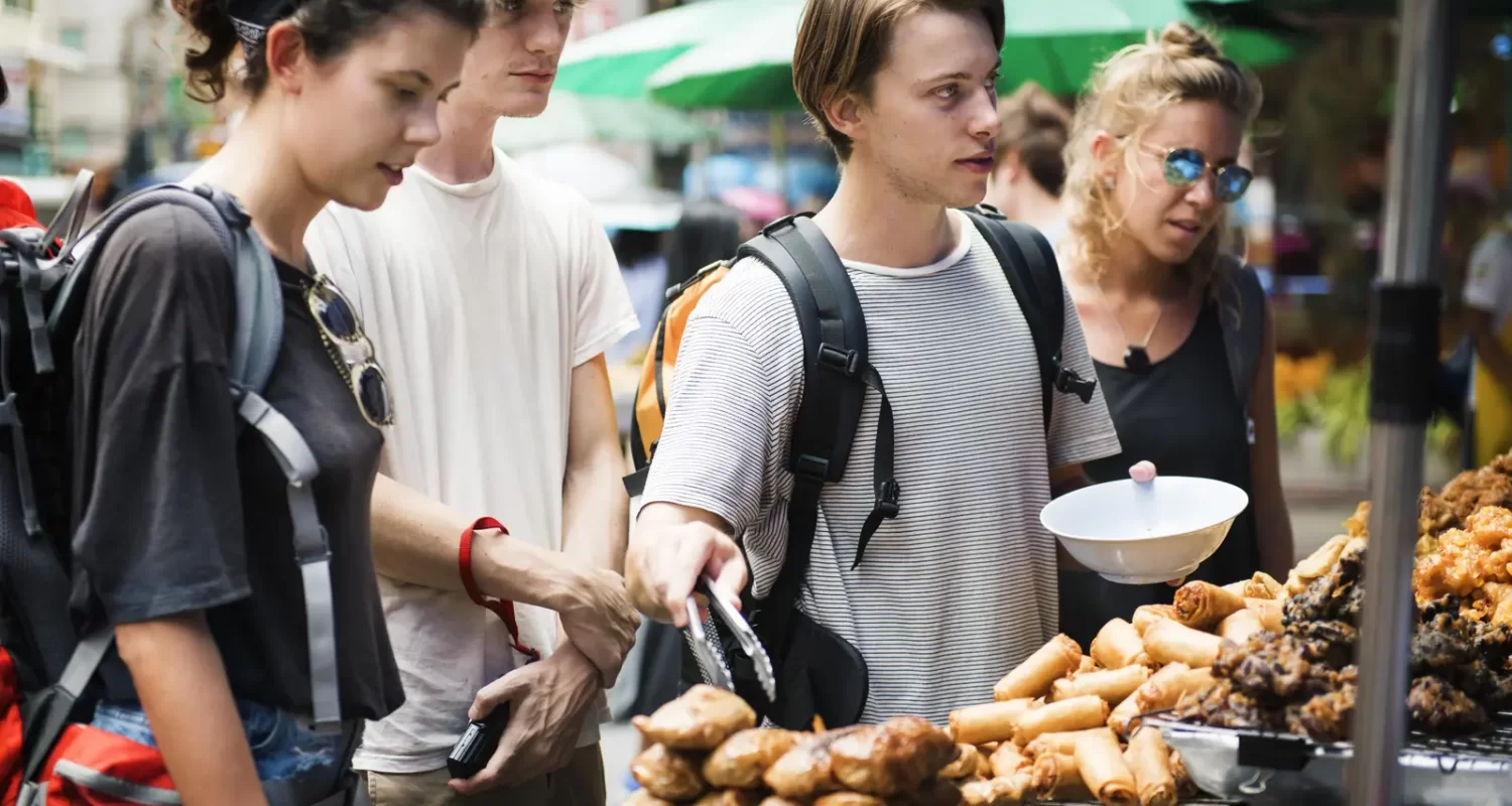 group-tourists-buying-thai-food-food-stall