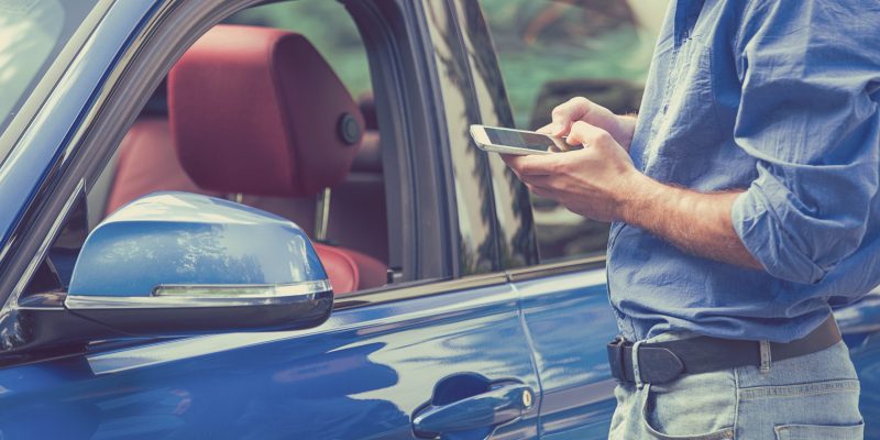 Mobile,Phone,Apps,For,Car,Owners,Concept.,Man,Using,Smart Mobile,Phone,Apps,For,Car,Owners,Concept.,Man,Using,Smart